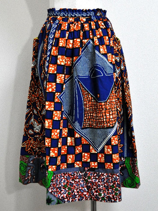 ポケット付きギャザー切り替えスカート・オレンジ×バッグ